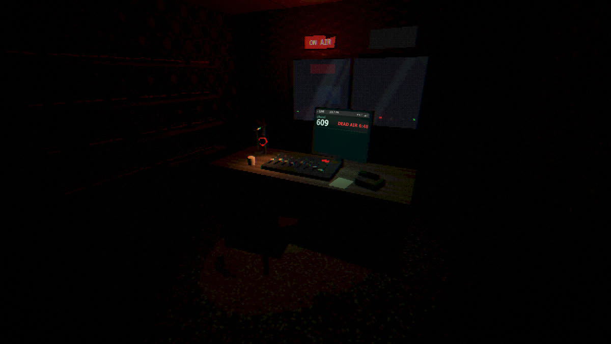 The studio seen from the doorway, dead air on the monitor